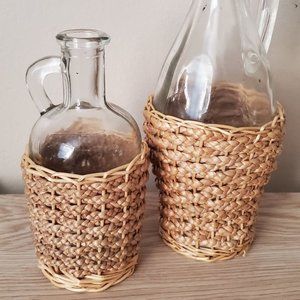 two glass vases with rattan woven wrapped beach co